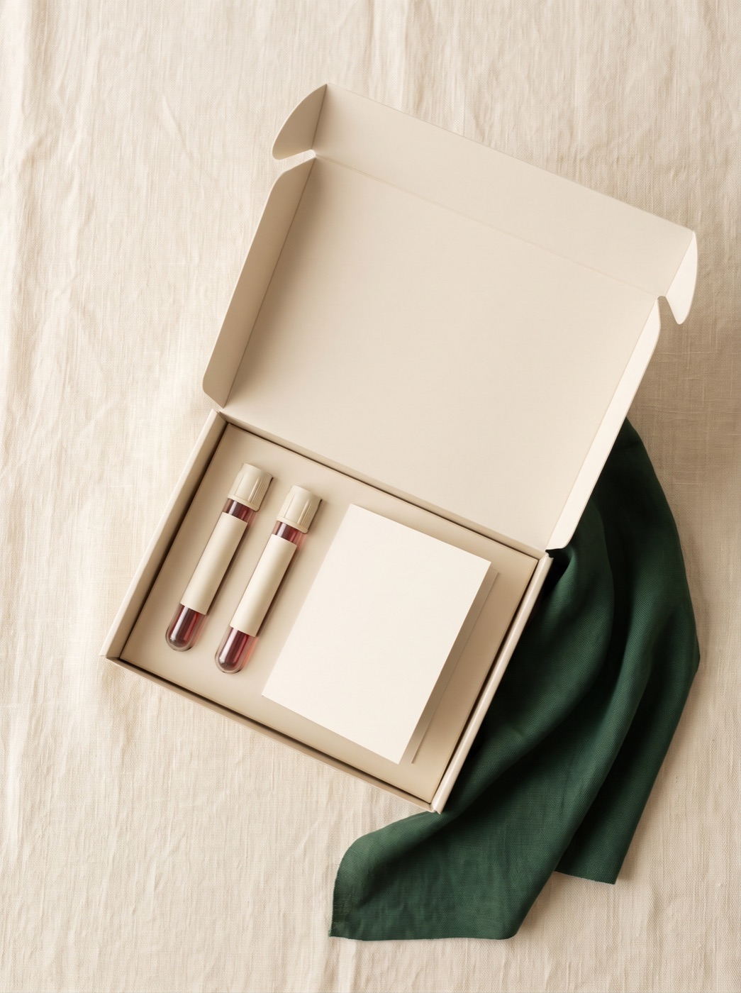 An at-home lab test kit on a linen surface